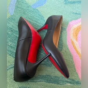 Classic Black Pump with Iconic Red Soles. Vogue says Pumps are hot! Size below